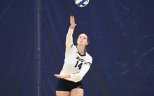 Kendall Johnson serving volleyball