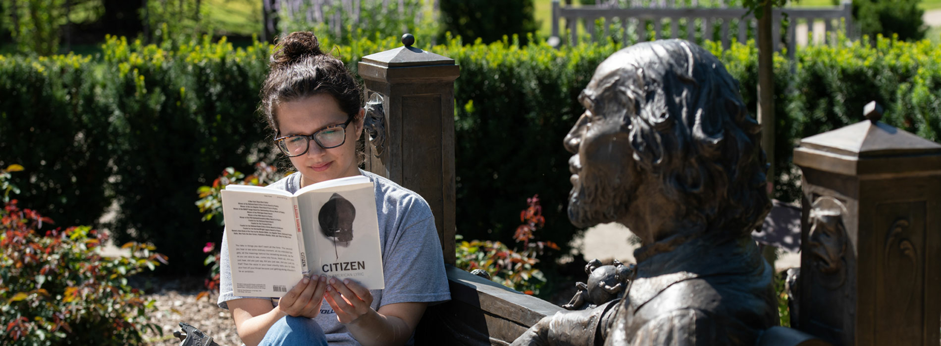 Student reading in Shakespeare Garden