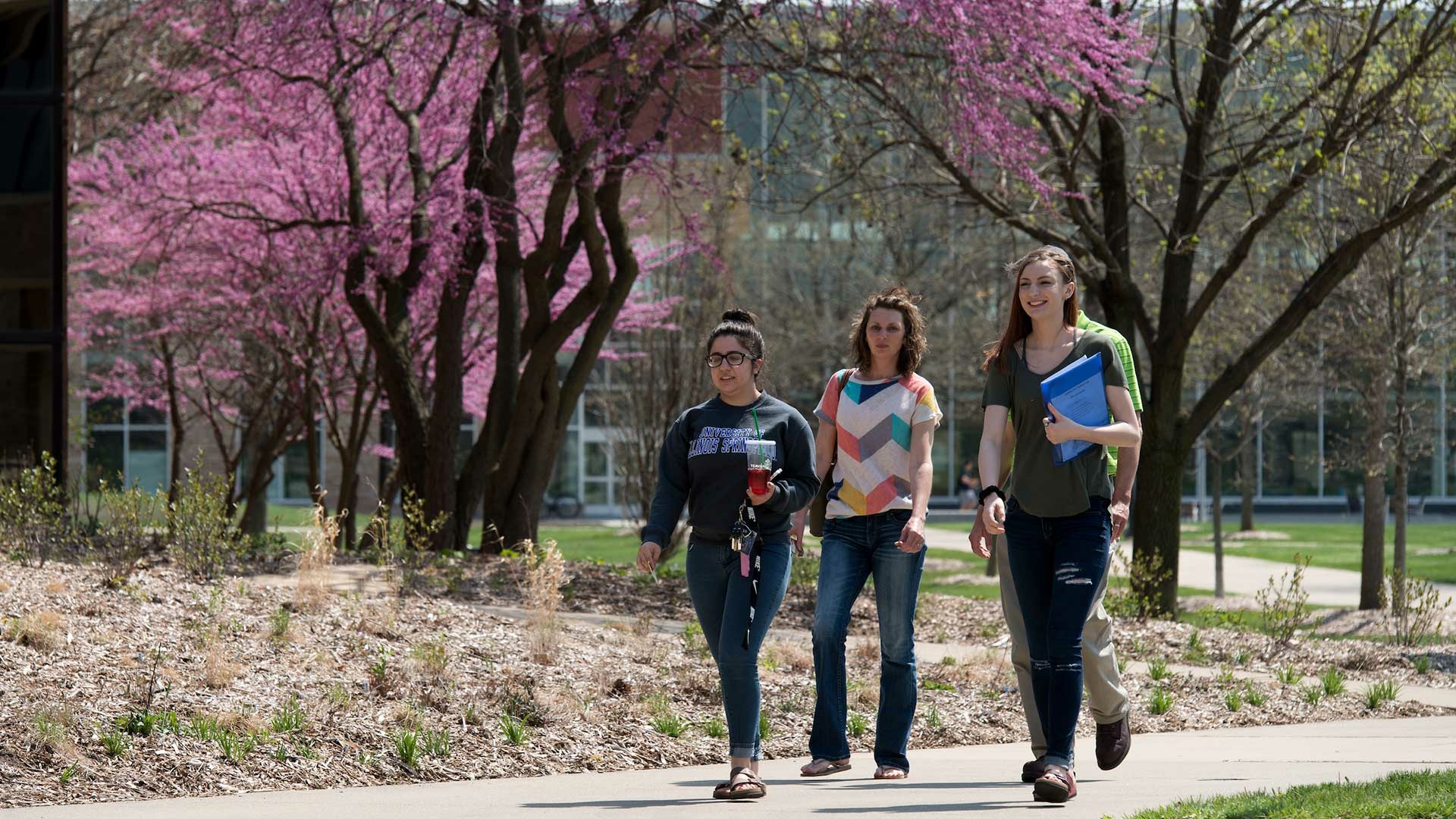 women walking on campus