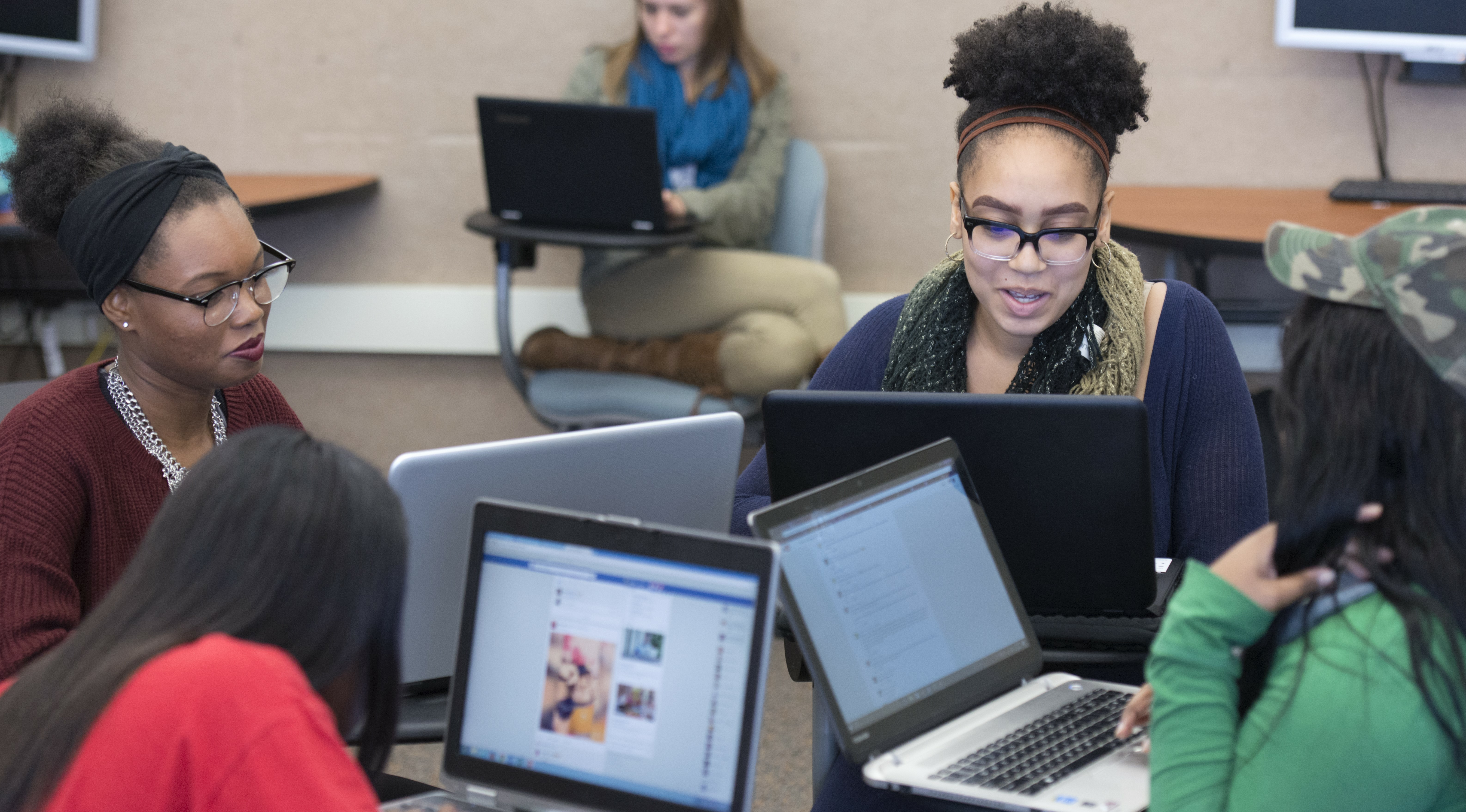 English subpage image, students working on laptops