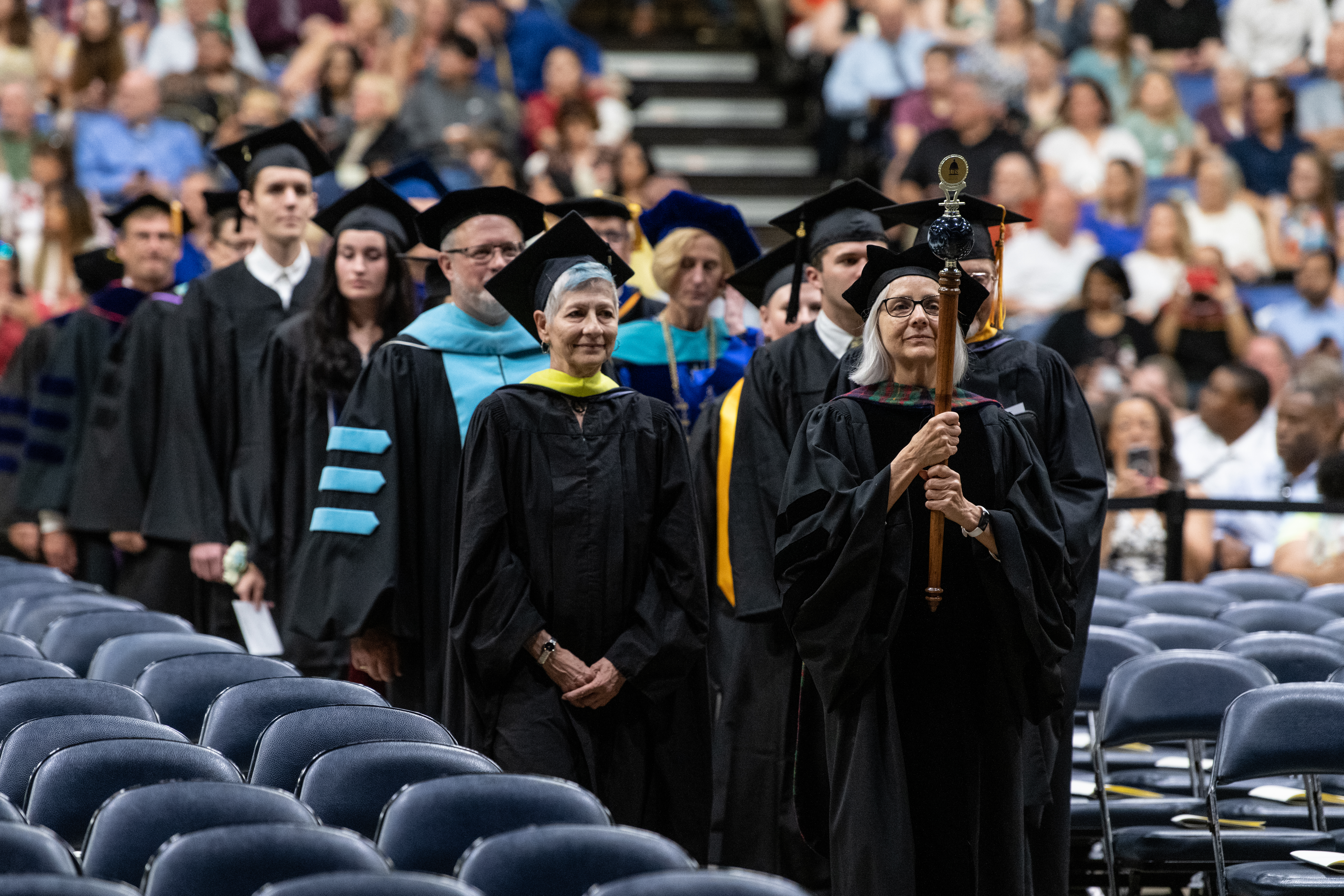 Faculty and graduate attending Commencement