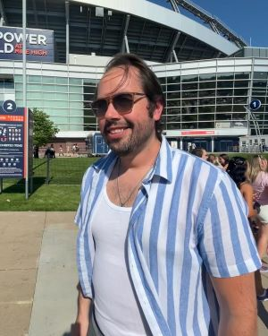 Robert Fair in front of a stadium