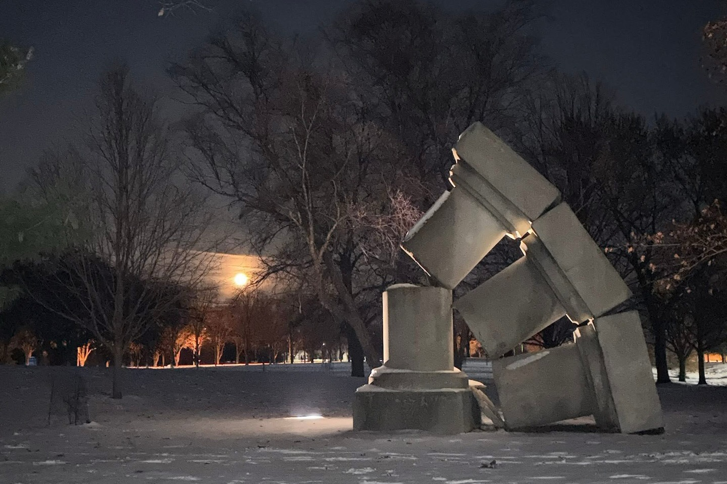 Impermanent Column (artwork) on campus at night