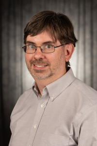 Headshot of James Nickras.