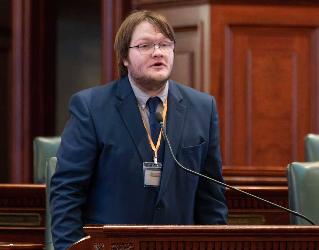 A man speaking at a podium.