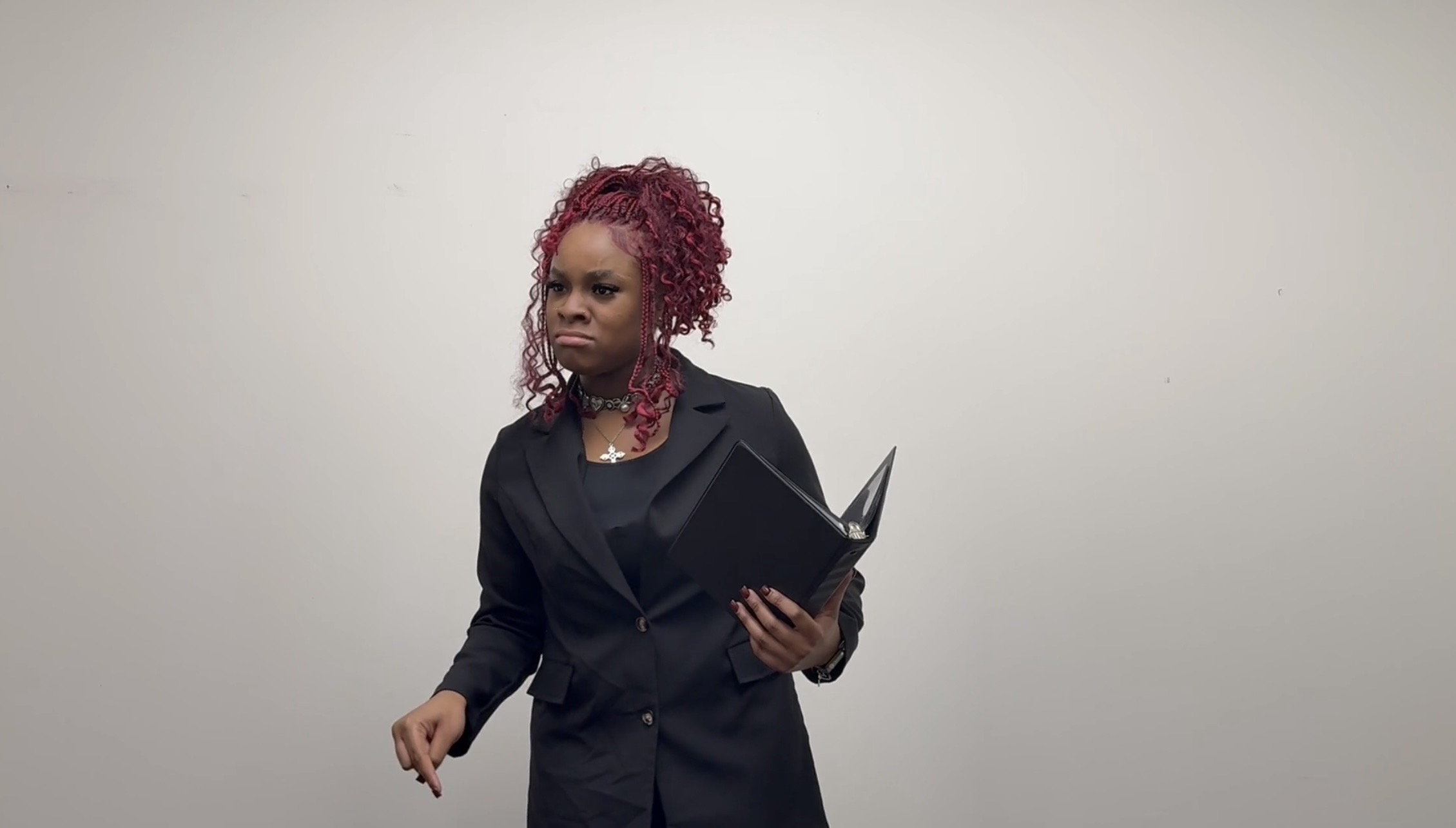 Rian Coleman presents at a speech and debate team presentation.