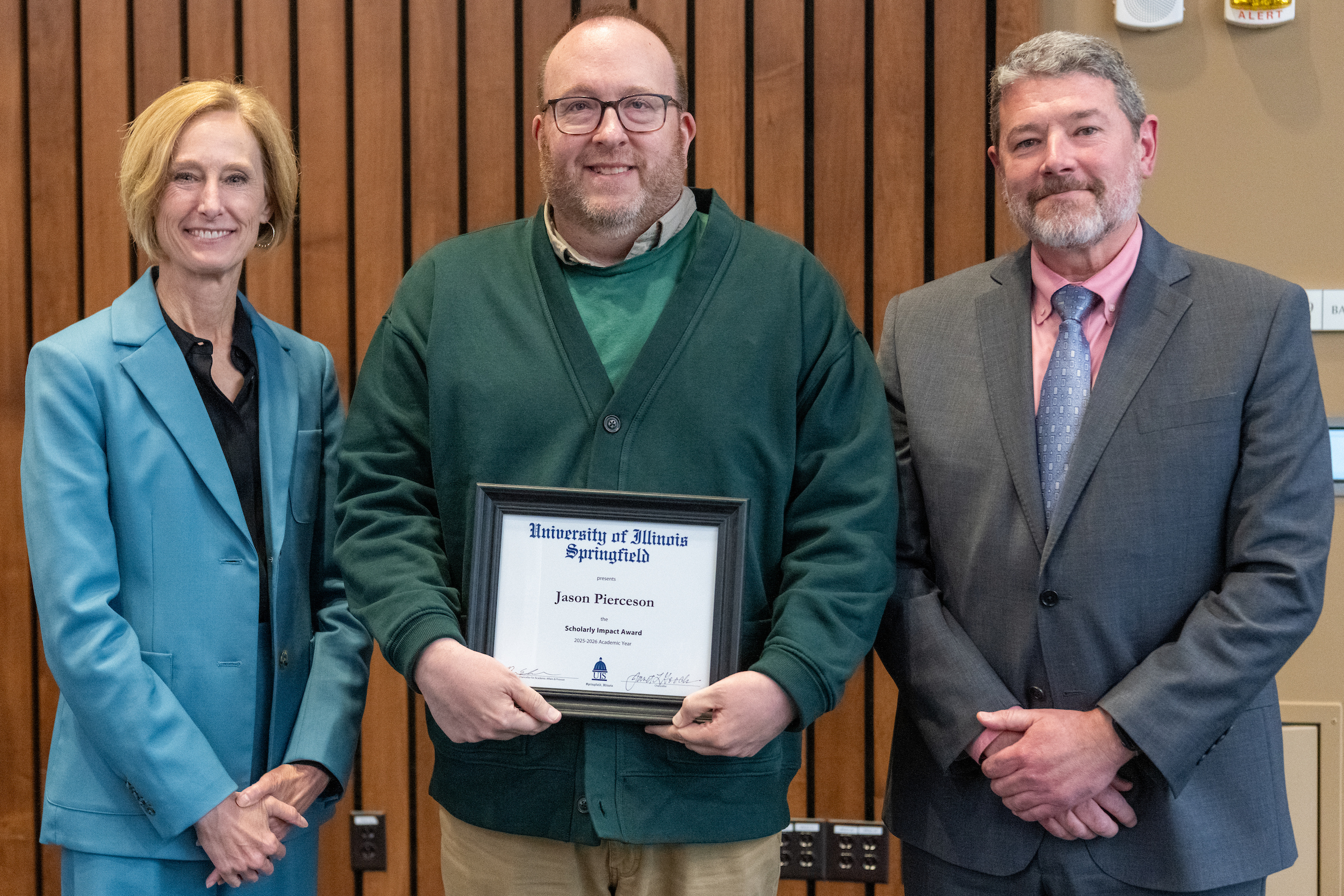 Chancellor Gooch, Jason Pierceson with framed award, Provost Schwab