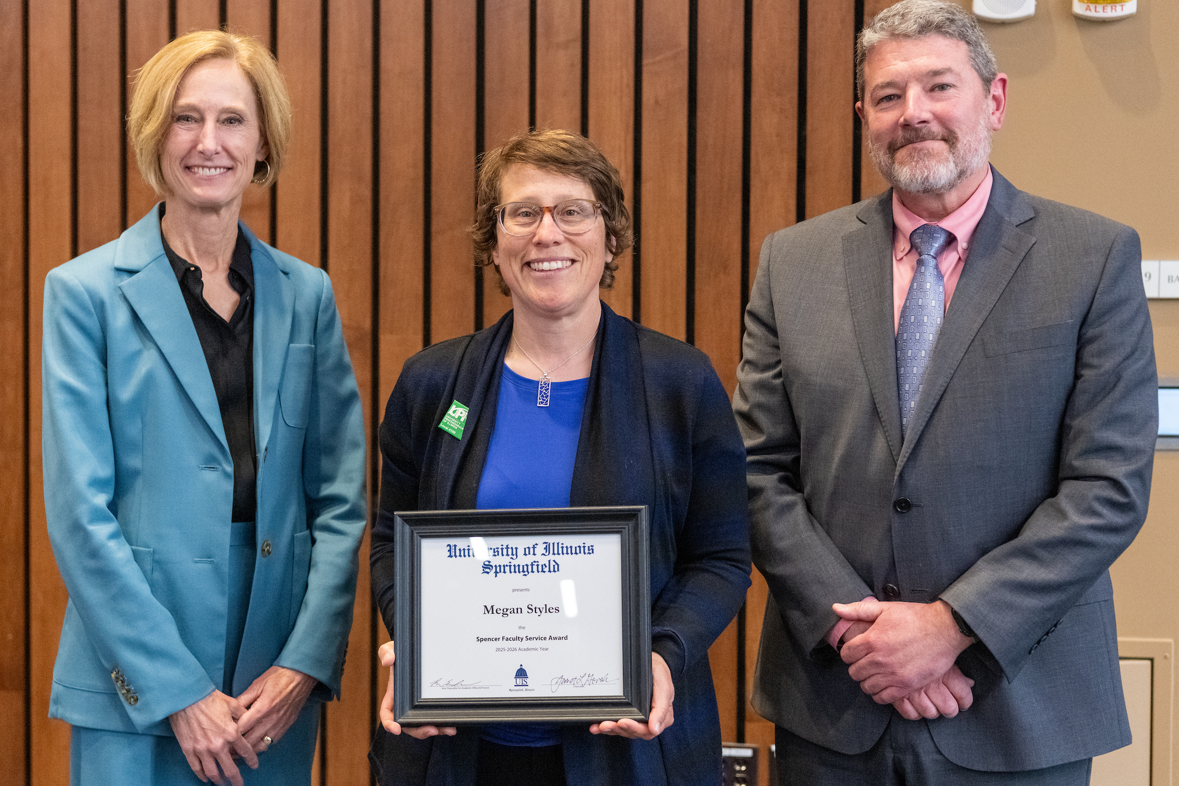 Chancellor Gooch, Megan Styles with framed award, Provost Schwab