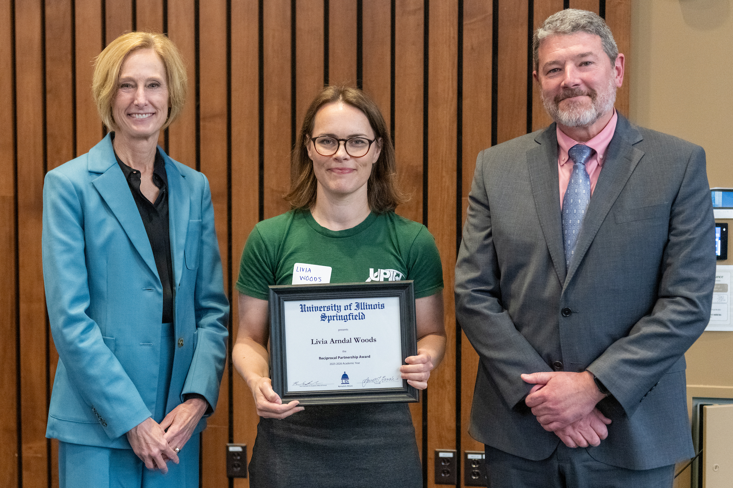 Chancellor Gooch, Livia Arndal Woods with framed award, Provost Schwab