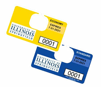 Yellow and blue University of Illinois parking permits.