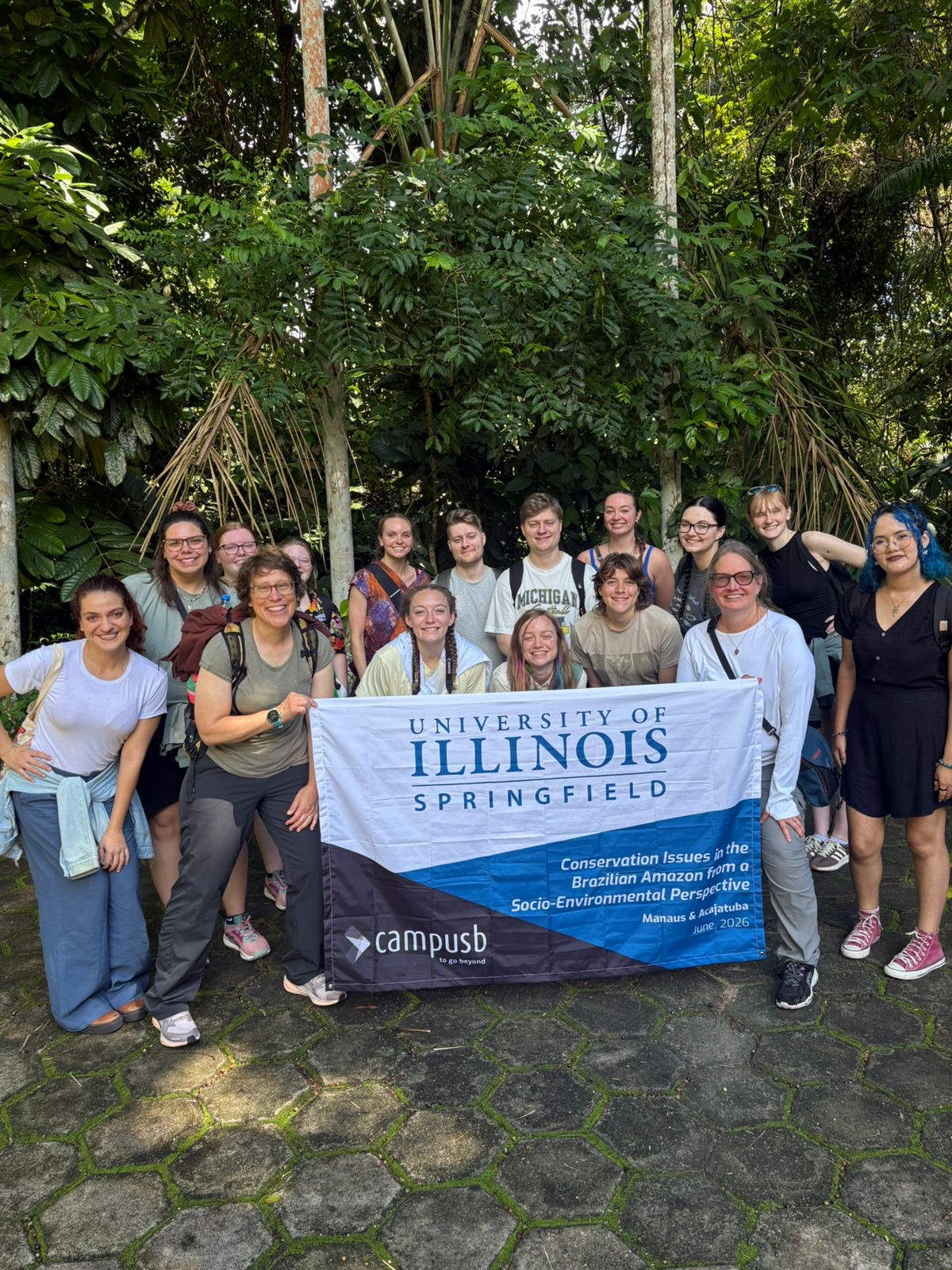Summer 2026 Brazil Group photo in front of the UIS flag