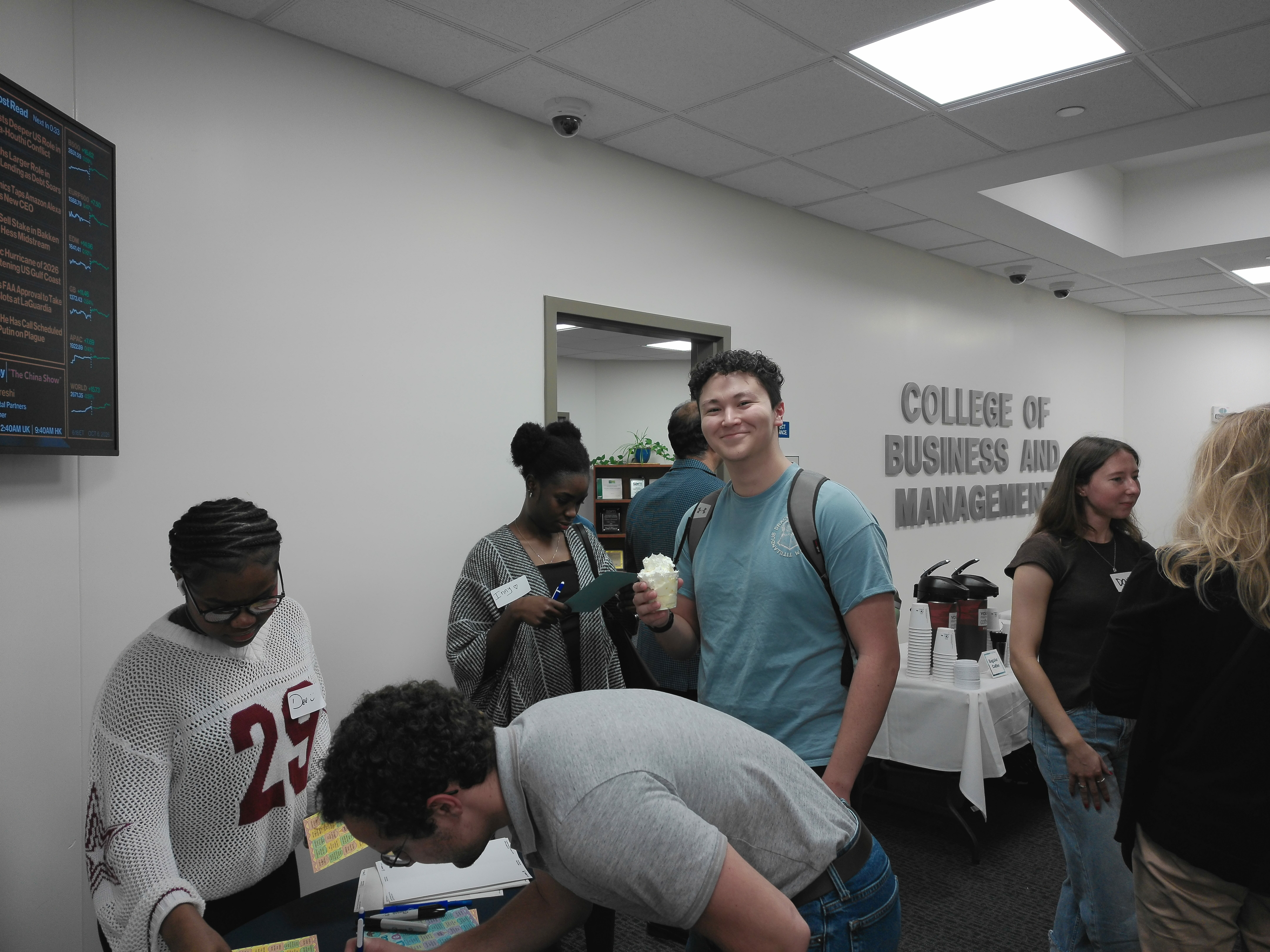 MBA students participate in bingo and enjoy ice cream during the Scoop & Socialize event in the College of Business and Management.