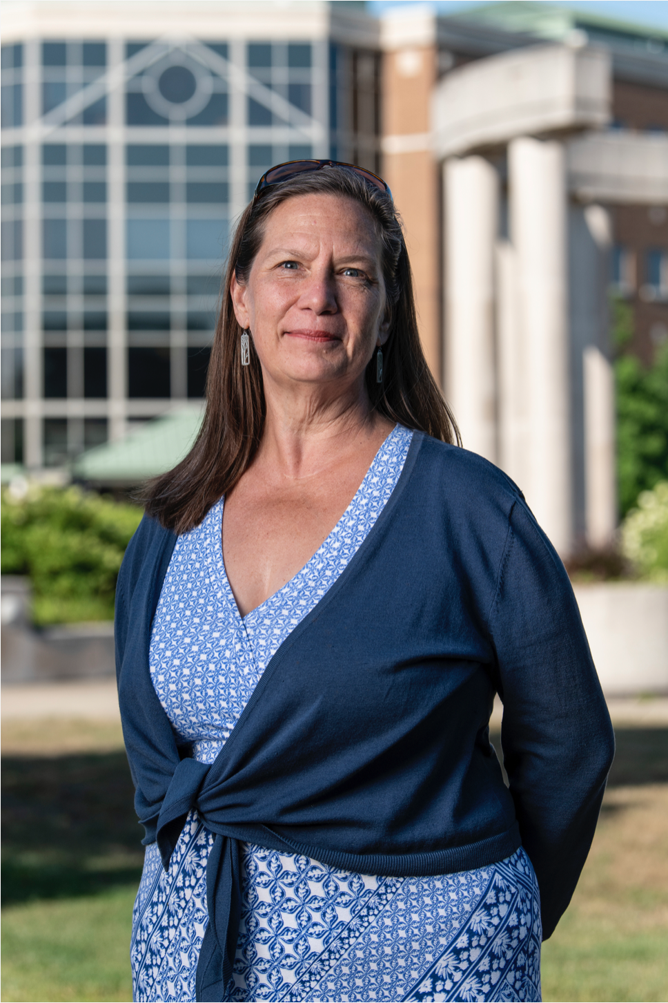 Dean Miriam L. Wallace standing on the quad