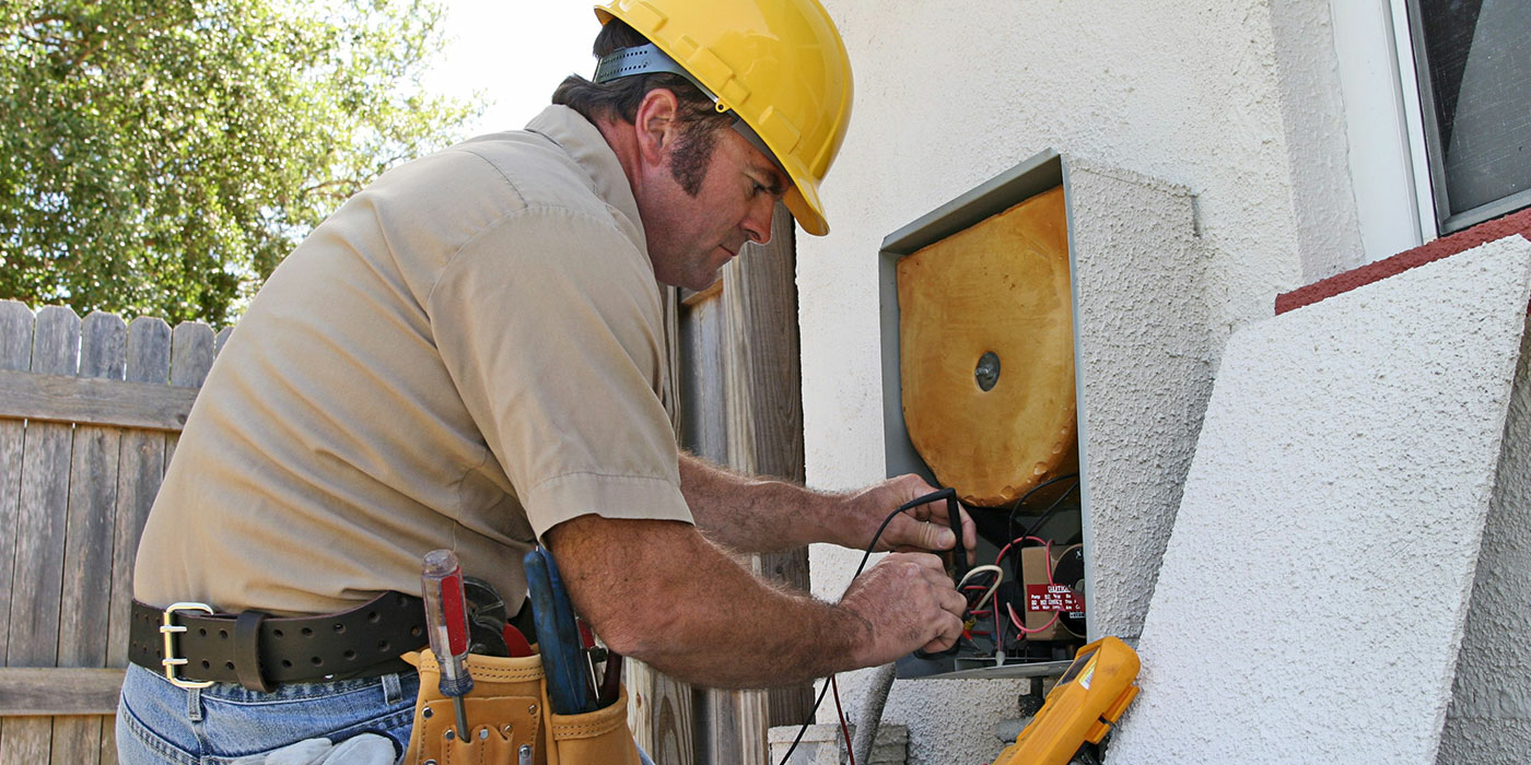 Person working on an air conditioner
