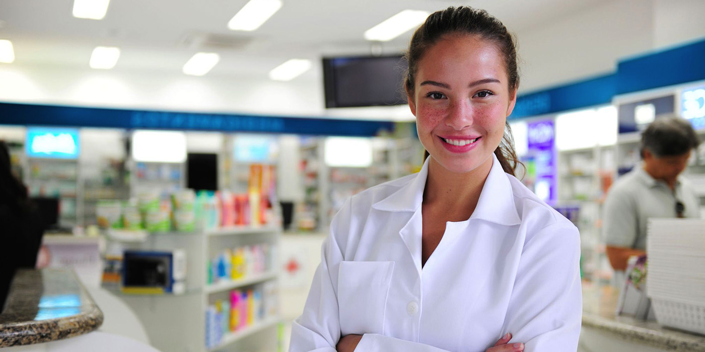 Picture of a tech in a pharmacy. 