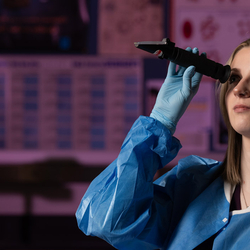 student performing microbiology testing
