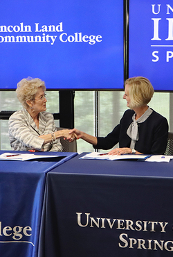 LLCC President Charlotte Warren and UIS Chancellor Janet Gooch shake hands