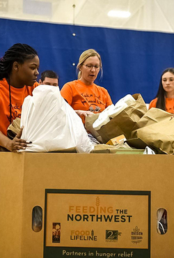 Students with a box of collected food