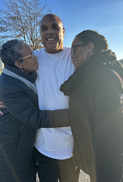 Brian Beals hugged by family members