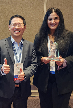Brian Chen and Zainab Yaseen pose with the award.