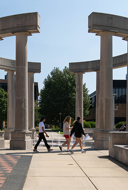 Students walk through the colonnade at the University of Illinois Springfield.