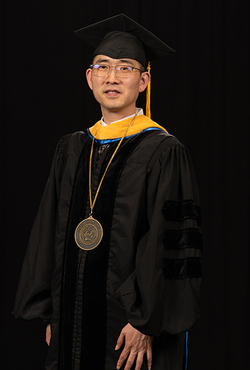 Yanhui Guo stands in regalia during his Ceremony of Investiture.