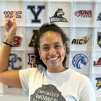 headshot of Regina Bolin in front of a wall with many university logos