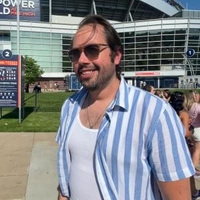 Robert Fair in front of a stadium