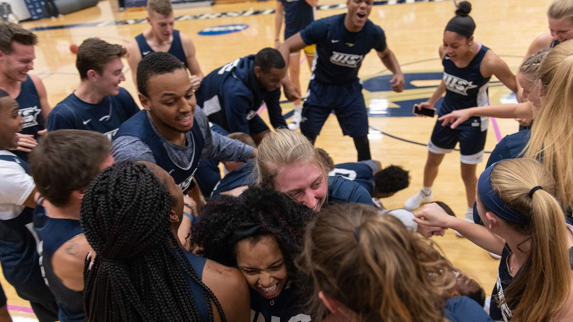 student celebrating blue madness