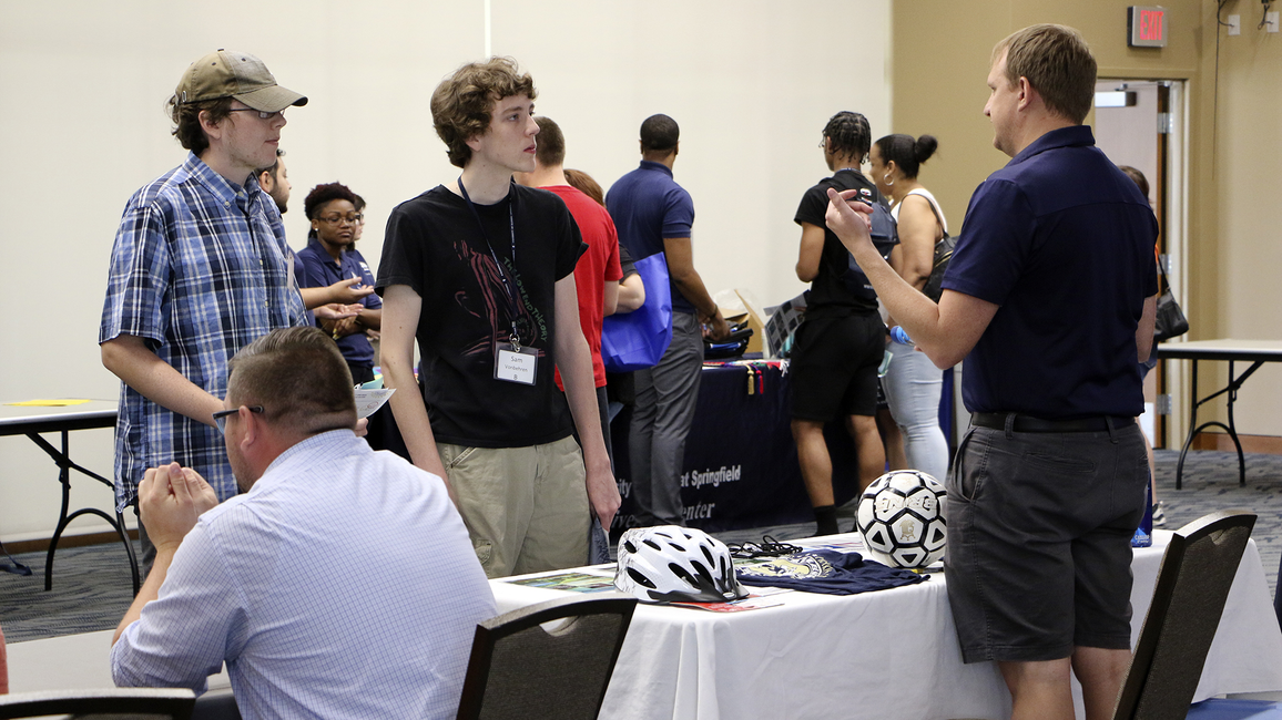 Student meeting with staff