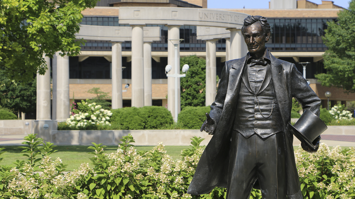 The Abraham Lincoln statue at UIS with the colonnade in the background.