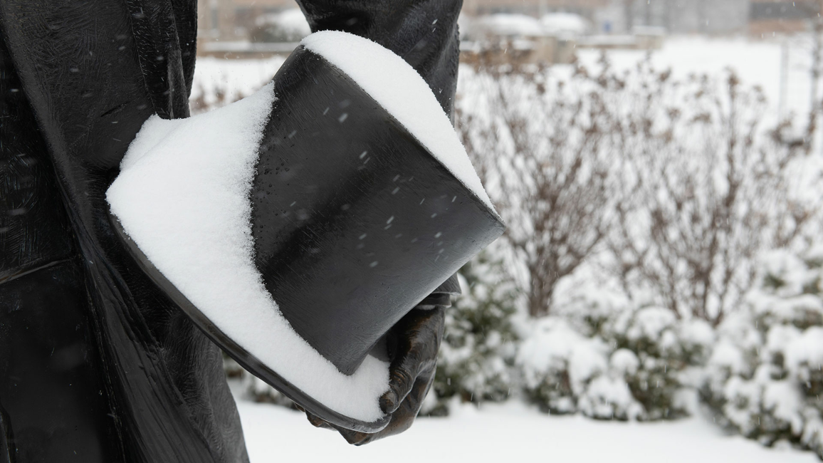 close up of statue of Lincoln's top hat covered in snow