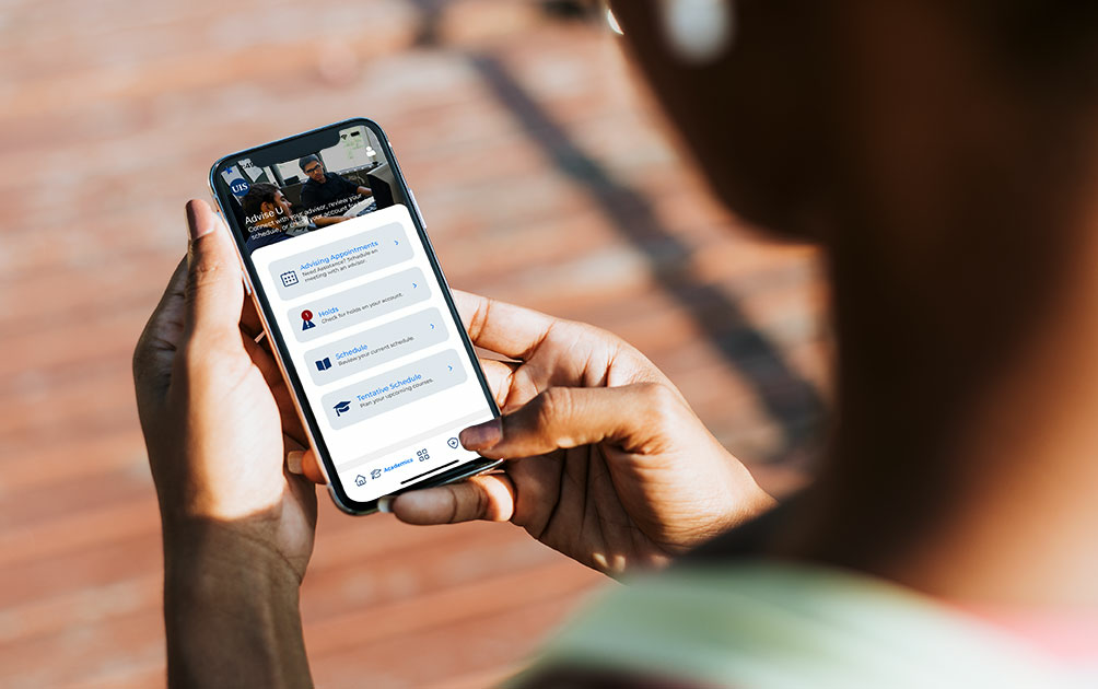 Person holding a smartphone, reading messages.