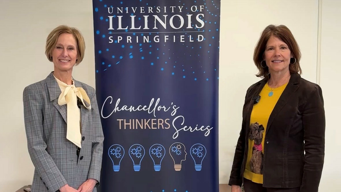 Two women standing beside a "Chancellor's Thinkers Series" banner.