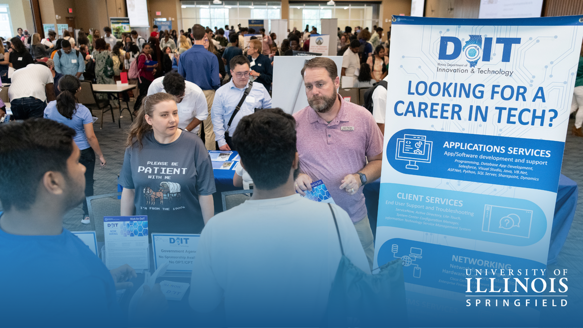 Students at booth at a career fair.