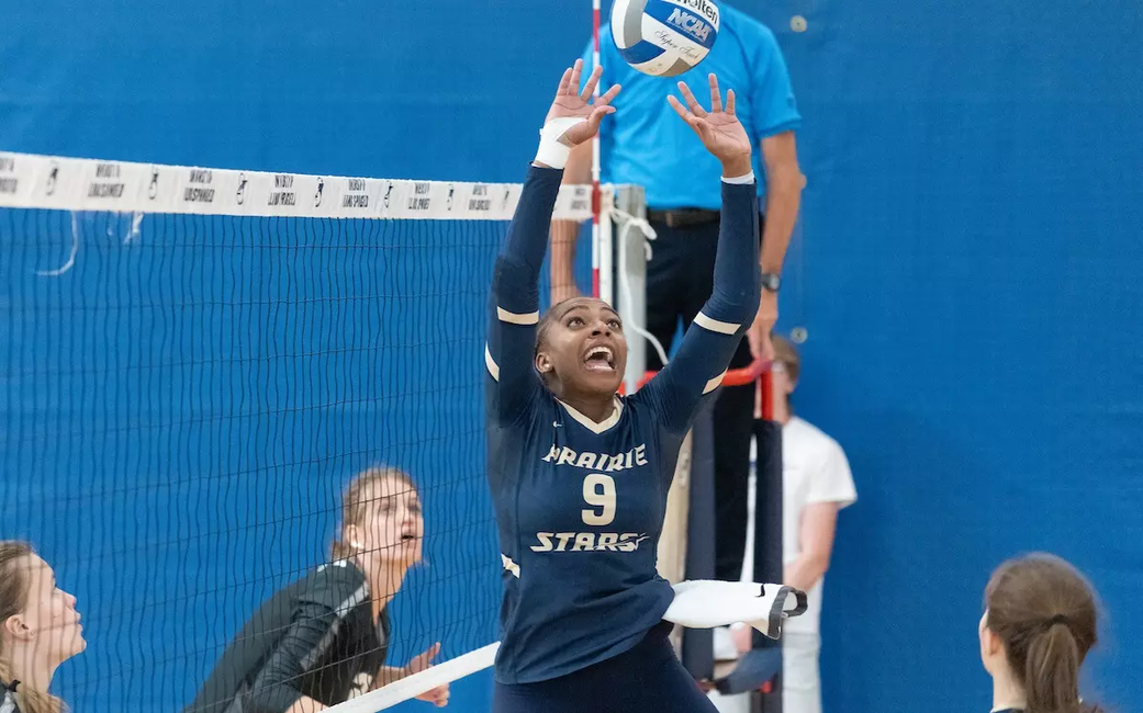 Erica Sledge setting the ball