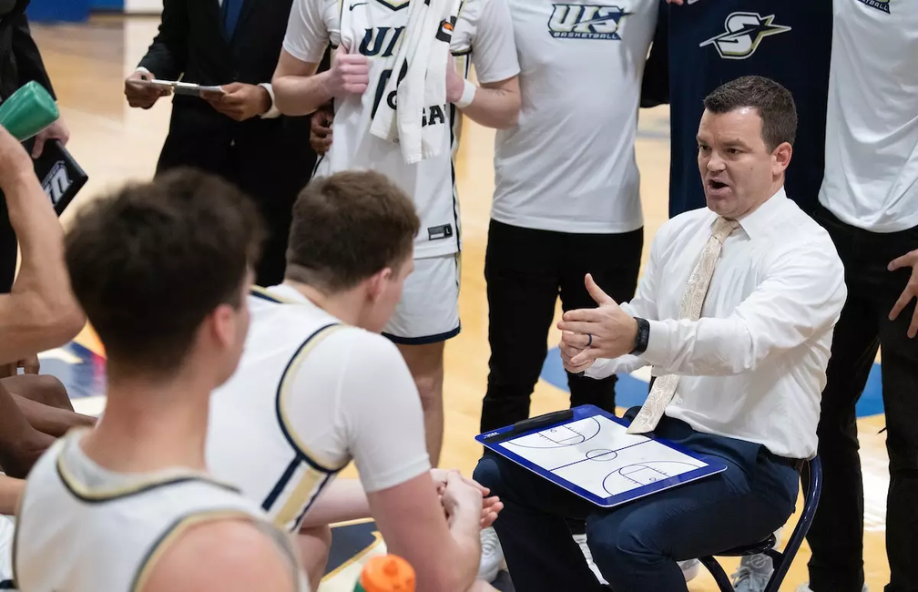 Coach Matt Brock speaking to the team