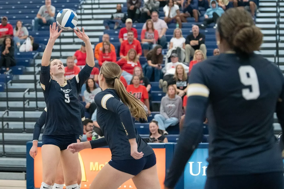 Anna Laincz sets Kendall Johnson up for an attack