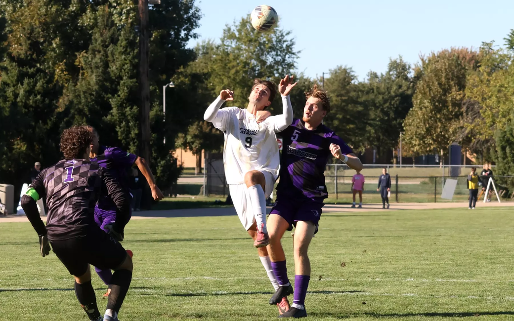 Robin Lemke Bergseth playing soccer in white UIS uniform