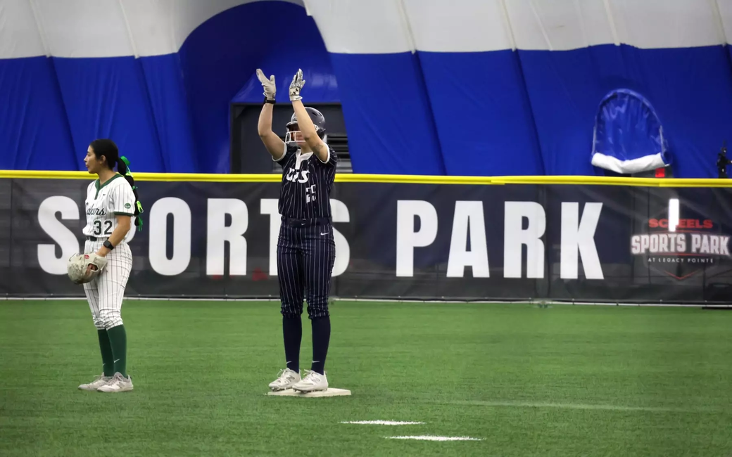 Calista Stahlhut celebrates on second base