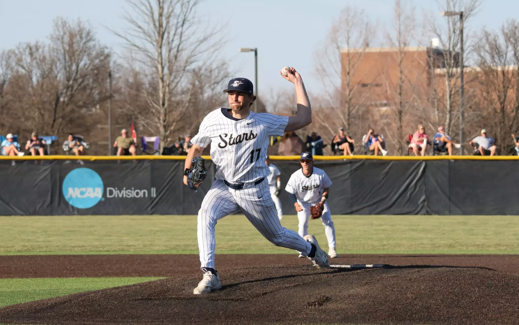 Graham Kasey pitching in white UIS uniform