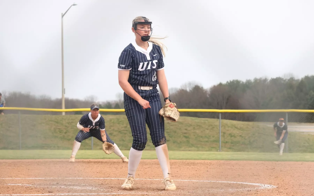 Calista Stahlhut  pitching in blue UIS uniform