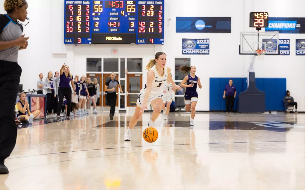 Julia Mingus dribbles down the court
