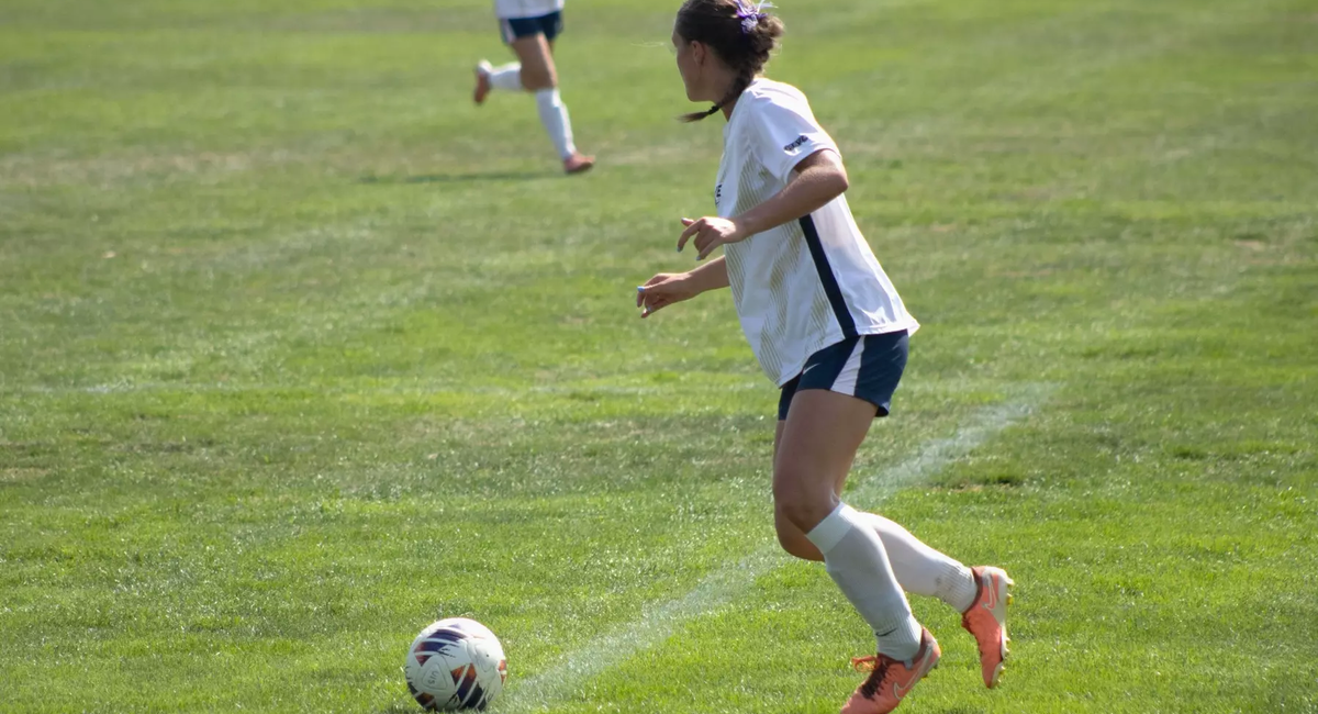 Abbie Gleason playing soccer