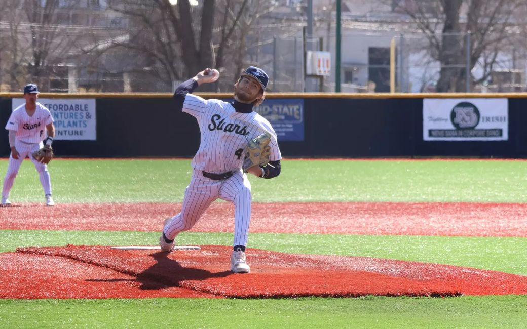 Trey Carter pitching in white UIS baseball uniform