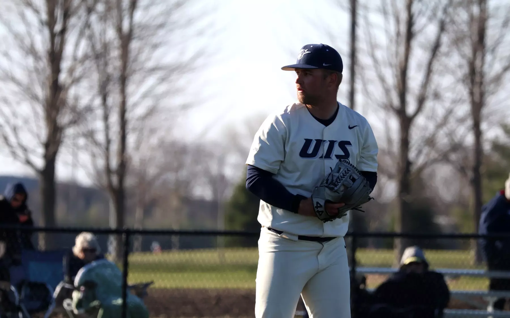 Quinn Hoftender pitching in white UIS uniform