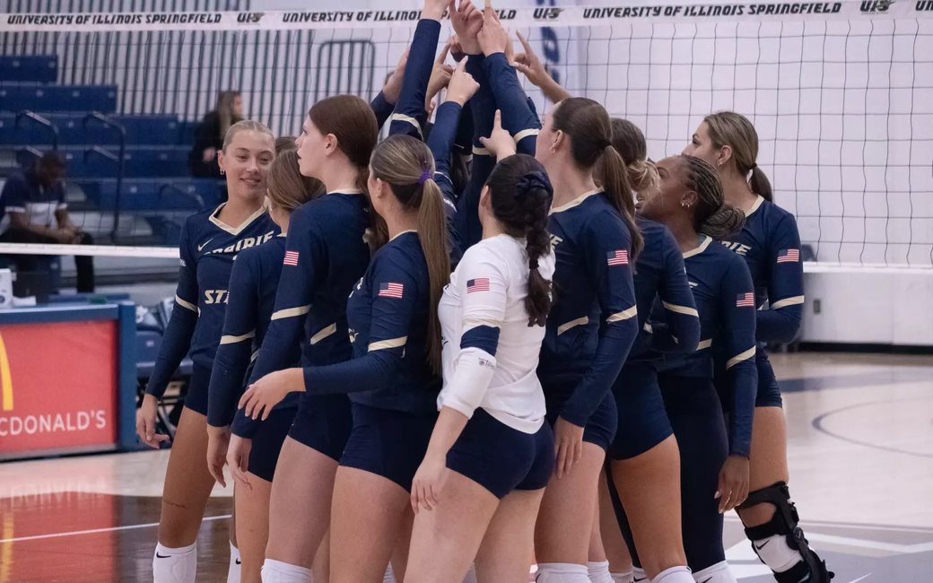 UIS volleyball team huddle
