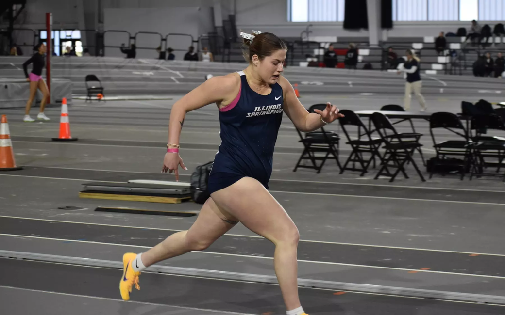 Kalli Drexler running track in blue UIS uniform