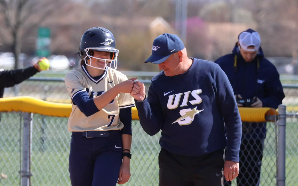 Rosie Bartletti and Coach Dan Frank on first base 