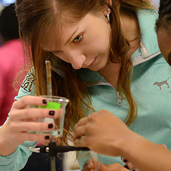 chemistry students performing an experiment